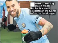  ??  ?? PARTY TIME: City match winner Nicolas Otamendi celebrates in the tunnel before the brawl began