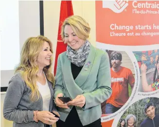  ?? TERRENCE MCEACHERN/SALTWIRE NETWORK ?? Family and Human Services Minister Tina Mundy, left, and Andrea MacDonald, CEO of the United Way of P.E.I., are shown at Monday’s funding announceme­nt for a new 2-1-1 service for the Island, expected in the fall.