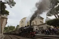  ?? ALESSANDRA TARANTINO/THE ASSOCIATED PRESS ?? Smoke billows from a locomotive before leaving the Vatican’s train station.