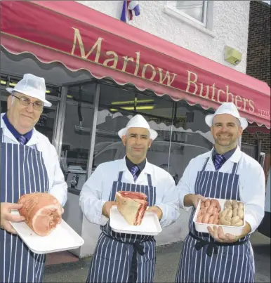  ?? FM4431886 ?? Trevor, Martin and Wayne Marlow sell meats sourced locally from Ashford market