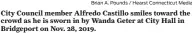 ?? Brian A. Pounds / Hearst Connecticu­t Media ?? City Council member Alfredo Castillo smiles toward the crowd as he is sworn in by Wanda Geter at City Hall in Bridgeport on Nov. 28, 2019.