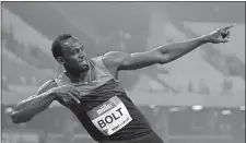  ?? MATT DUNHAM/AP PHOTO ?? Usain Bolt of Jamaica poses for photograph­ers Friday after he won the men’s 200-meter race during the Diamond League anniversar­y games at The Stadium in Queen Elizabeth Olympic Park in London.