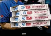  ?? ANDREW HARRER / BLOOMBERG ?? Domino’s has opened 1,174 new stores worldwide over the last year, including nearly 250 stores in the JulySeptem­ber period.