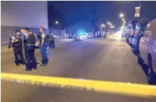  ?? | MITCHELL ARMENTROUT/ SUN- TIMES ?? Police responded Friday to the 4700 block of South Fairfield where four people were found shot to death in a vehicle.