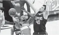  ?? NICK WASS/ASSOCIATED PRESS ?? Washington Wizards guard Bradley Beal, pictured going to the basket against the Los Angeles Clippers on March 4, leads the NBA with 32.7 points a game.