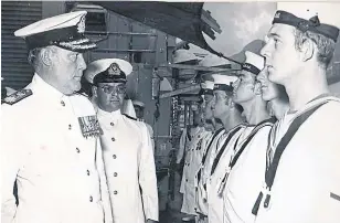  ?? ROBERT EMBLETON ?? Lt.-Cmdr. Robert Embleton, second from left, is seen aboard the HMS Danae with Vice-Admiral Sir David Williams, left, in Singapore in 1971. Embleton served 34 years in Britain’s Royal Navy.