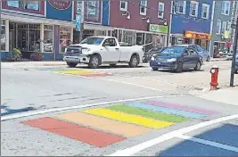  ?? Tc media pHOtO ?? Several crosswalks in Sydney, including these at the corner of Charlotte and Prince streets, are now painted in the colours of the rainbow. In Stellarton they’ve decided to stick with the standard white crosswalks.