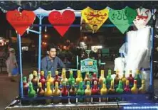  ??  ?? Different kinds of sherbets on display at a street in Lahore.