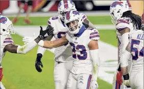  ?? Ross D. Franklin / Associated Press ?? Micah Hyde, center, and Buffalo have had a lot to celebrate so far this season, but Pittsburgh comes in angry after a loss to Washington.
