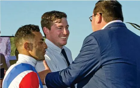  ?? Photo: Nev Madsen ?? HOME VICTORY: Ben Currie (centre) celebrates his Weetwood Handicap win with Amanaat at Clifford Park in April.