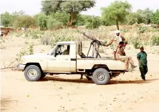  ?? — AFP file photo ?? A convoy of Sudanese security forces deploy during a rally in El-Geneina.