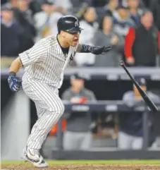  ??  ?? Gary Sanchez of the New York Yankees celebrates after hitting a two-run double against the Houston Astros.