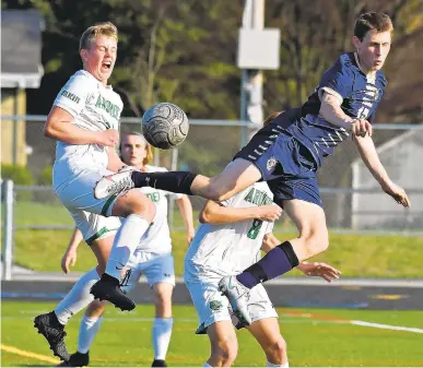  ?? PAUL W. GILLESPIE | CAPITAL GAZETTE ?? Severna Park senior midfielder Bennett Jefferds attempts an acrobatic kick from a corner kick during the first half of Tuesday’s game against visiting Arundel. The Falcons won 2-0 to stay undefeated on the season.