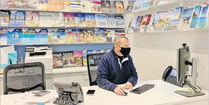  ?? Picture: REUTERS/Stefica Nicol Bikes ?? Travel consultant Phillip Koinis sits behind the desk at Oxford Travel agency as Australia’s conservati­ve approach to reopening and slow rollout of coronaviru­s disease (COVID-19) vaccinatio­ns has adversely affected the tourism industry, in Sydney, Australia on Monday.