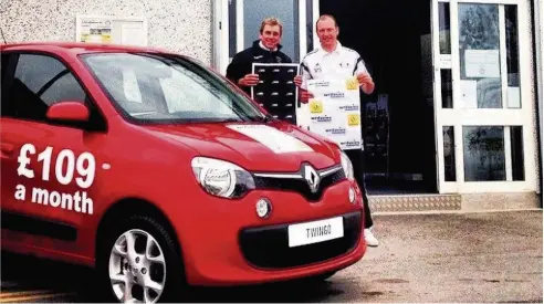  ??  ?? Llandudno FC chairman Clive Rushton (left) and commercial director Mike Smith celebrate the club’s twoyear kit deals