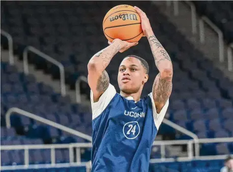  ?? Jim Franco/Times Union ?? UConn sophomore Jordan Hawkins shoots during an open practice prior to the NCAA tournament on Thursday at the MVP Arena in Albany, NY.