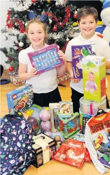  ??  ?? Delighted Maya Graham, eight, and Olly Moore, nine, were pleased with their purchases