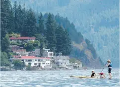  ?? JONATHAN HAYWARD / THE CANADIAN PRESS ?? The average price of a recreation­al home in B.C. is expected to fall 2.8 per cent by the end of September.