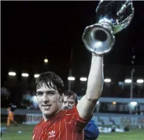  ?? ?? Above right: McGhee with the Cup Winners’ Cup.