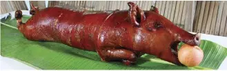  ?? Lechon photo courtesy UH-Maui College ?? Chef Instructor Jake Belmonte of the University of Hawaii Maui College Culinary Arts Program will present an event on campus to help Bahay Kubo in Iao Valley from further deteriorat­ion. A whole lechon, or roast pig, will be served at The Field and the...