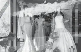  ?? SUMAN NAISHADHAM/AP ?? Mannequins in wedding gowns are displayed last week at a bridal store in Nogales, Arizona. The shop has been closed for a year because of the pandemic.