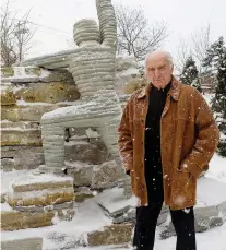  ?? PIERRE OBENDRaUF ?? Harry Rosen, pictured in 2010, stands next to the statue he sculpted called The Ascent, which stands in front of the Lady Davis pavilion of the Jewish General Hospital.