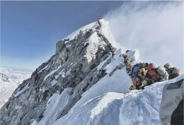  ?? PICTURE: NIRMAL PURJA/ PROJECT POSSIBLE/ AFP ?? 0 Climbers lining up to stand at the summit of Mount Everest last week were captured by Nirmal Purja’s Project Possible expedition