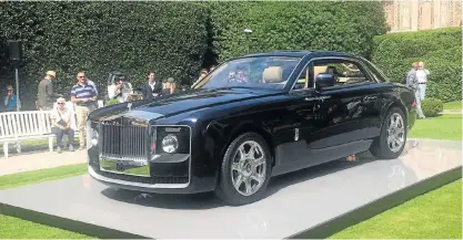  ??  ?? The RollsRoyce Sweptail was unveiled on the banks of Lake Como in Italy. Below: Giles Taylor, Rolls-Royce design director, reveals the swept tail design that is inspired by cars of the 1920s.