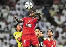  ?? Virendra Saklani/Gulf News ?? High risk Esmail Al Hammadi of Al Ahli battles for the ball against Bezerra Maciel Junior of Guangzhou of China during the final of AFC Champions League.