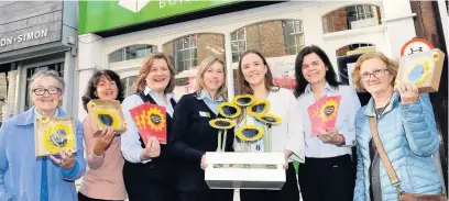  ?? Andrew Pickford ?? Kate Bowmar (third right) from East Cheshire Hospice with staff from Leek United Building Society.