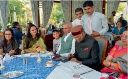  ?? — PTI ?? President Ram Nath Kovind uses a card swipe machine during his visit to a restaurant at The Ridge in Shimla on Tuesday.