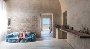  ?? ITALY SOTHEBY’S INTERNATIO­NAL REALTY PHOTOS ?? Spacious rooms in the converted, 17th-century olive-oil mill feature vaulted, curved ceilings and are furnished sparsely, with restored plaster walls left bare.