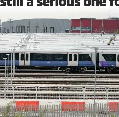  ?? ANTONY GUPPY. ?? On September 3, rows of TfL Rail Class 345s stand at Old Oak Common awaiting testing, unable to access the new railway’s infrastruc­ture due to constructi­on delays.