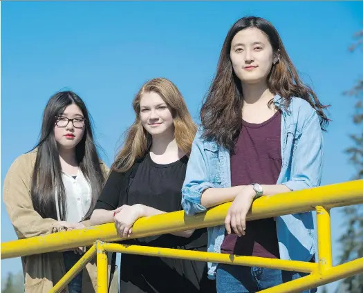  ?? GERRY KAHRMANN ?? High school students Jessica Kim, Joanna Kaczmarek and Elly Choi, left to right, are part of a social justice task force that is lobbying municipal government­s to do more to help homeless youth in Langley. A shelter is needed so youth in Langley ‘don’t have to relocate to other places like Surrey and Abbotsford,’ Choi says.