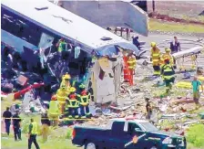  ?? SOURCE: KRQE ?? This photo taken from video shows the aftermath of a crash involving a Greyhound bus and a tractor-trailer on Interstate 40 near Thoreau, about 100 miles west of Albuquerqu­e. The crash happened after a tire on the semi-truck failed and the vehicle collided with the bus.