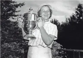  ?? ASSOCIATED PRESS ?? Babe Didrikson Zaharias holds the Women’s U.S. Open Golf Championsh­ip trophy in 1954.