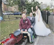  ??  ?? Chris and Rebecca Spokes with park train driver John Faulkner.