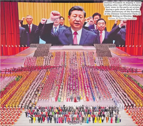  ?? Picture: AP Photo/Ng Han Guan ?? Chinese President Xi Jinping is seen leading other top officials pledging their vows to the party on screen during a gala show ahead of the 100th anniversar­y of the founding of the Chinese Communist Party in Beijing on Monday.