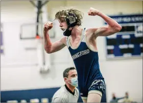  ?? NATE HECKENBERG­ER - FOR MEDIANEWS GROUP ?? Spring-Ford’s Cole Smith flexes after pinning Haverford’s Cole McFarland for the 106-pound championsh­ip.