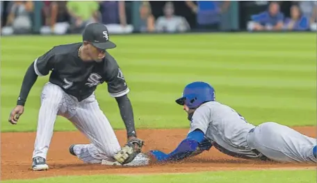  ?? Tannen Maury European Pressphoto Agency ?? CHRIS TAYLOR BEATS the tag by Chicago’s Tim Anderson to steal second in the first inning. He scored on a single by Cody Bellinger.
