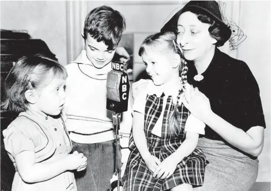  ?? CHICAGO TRIBUNE ARCHIVE ?? The script of NBC’s “Today’s Children” called for a scene in a day nursery. Author Irna Phillips is shown talking over the situation with her stars for the day.