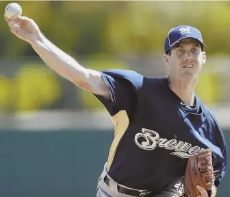  ?? 2010 AP FILE PHOTO ?? STUDIOUS APPROACH: Dave Bush, seen pitching for the Brewers during his playing days, is charged with bringing out the most of the Red Sox’ minor league pitchers.