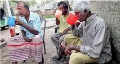  ??  ?? Fishermen enjoy a jug full of toddy at the Kepungoda toddy tavern