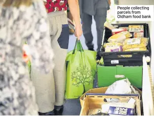  ??  ?? People collecting parcels from Oldham food bank