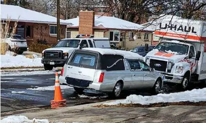  ?? ?? A hearse is parked outside a home where the remains of 30 people were found in Denver, Colorado. Photograph: Matt Glause