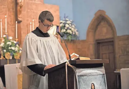  ?? RYAN BARNABI ?? Ryan Barnabi, now 25, pictured during a Mass in December at Immaculate Conception church in Dennison, when he served as a lector and altar boy. Barnabi's church is on the list of those recommende­d to be closed through the Columbus diocese's Real Presence, Real Future initiative.