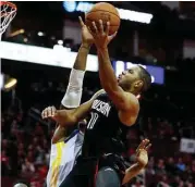  ?? Brett Coomer / Houston Chronicle ?? Rockets guard Eric Gordon, right, made half of his 24 field-goal attempts to lead the team with 30 points.