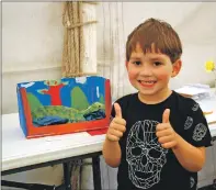  ?? 06_a33MAShow5­1 ?? Five-year-old Max Tighe from Ardrishaig was chuffed after winning first prize for his cardboard Loch Ness monster.