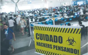  ?? (Nacho Doce/Reuters) ?? ‘WATCH OUT, hackers thinking’ warns a banner at an annual Internet users gathering in Sao Paulo, Brazil, in 2014 that gathers around 8000 hackers, developers and others from around the world.