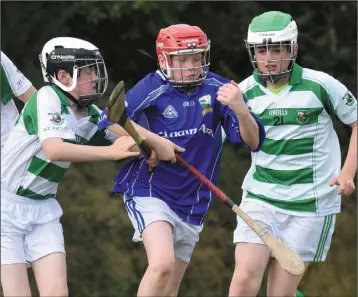  ??  ?? Ciarán Dempsey of Clonard in action against St. Fechin’s from Termonfeck­in in Louth in their Division 11 group game in Killurin on Friday.